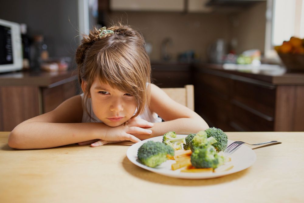 front-view-picky-girl-refuse-vegetables.jpg