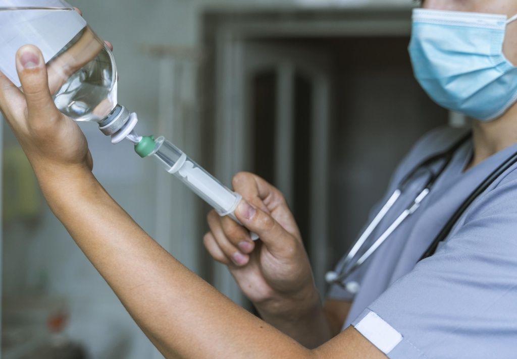 side-view-doctor-filling-up-syringe-with-medicine (1).jpg side-view-doctor-filling-up-syringe-with-medicine (1).jpg