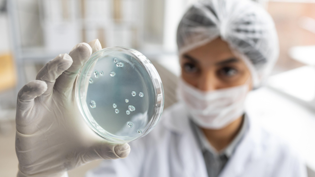 close-up-blurry-scientist-holding-petri-dish.jpg